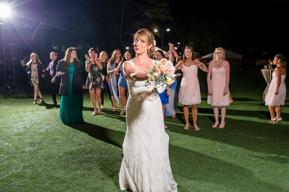 bride getting ready to toss her bouquet at Saratoga Springs