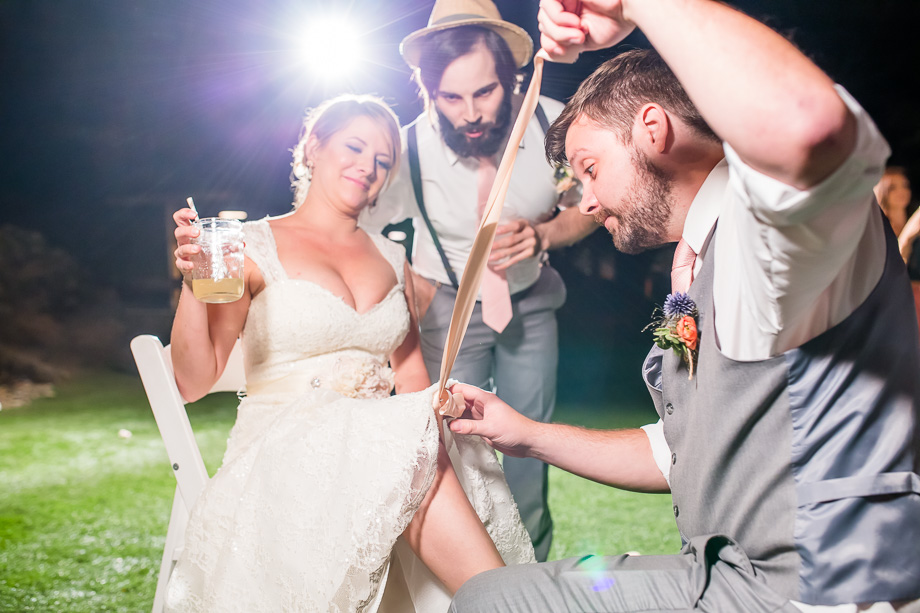 groom getting the garter