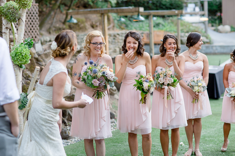bridesmaids laughing during wedding ceremony