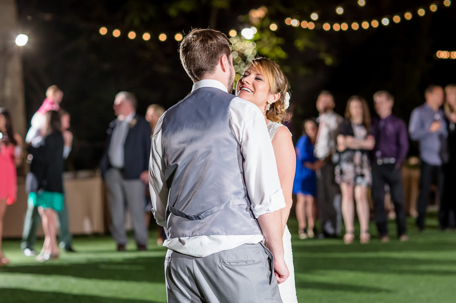 bride and groom dark reception with string lights