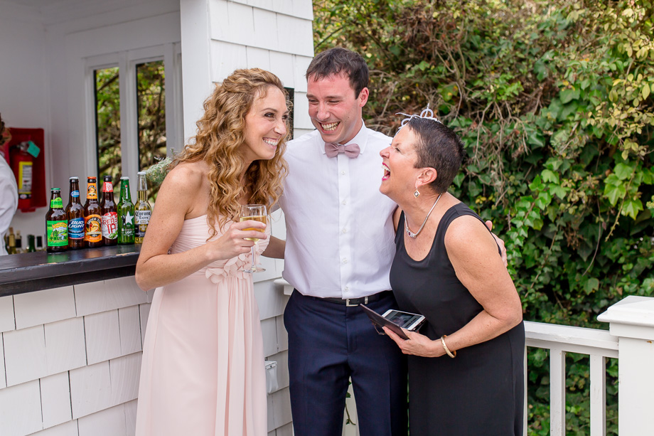 groom laughing with guests