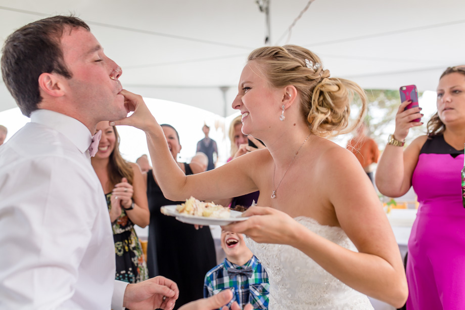 bride feeding groom cake