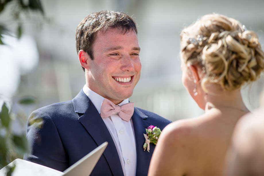 groom looking at bride during ceremony