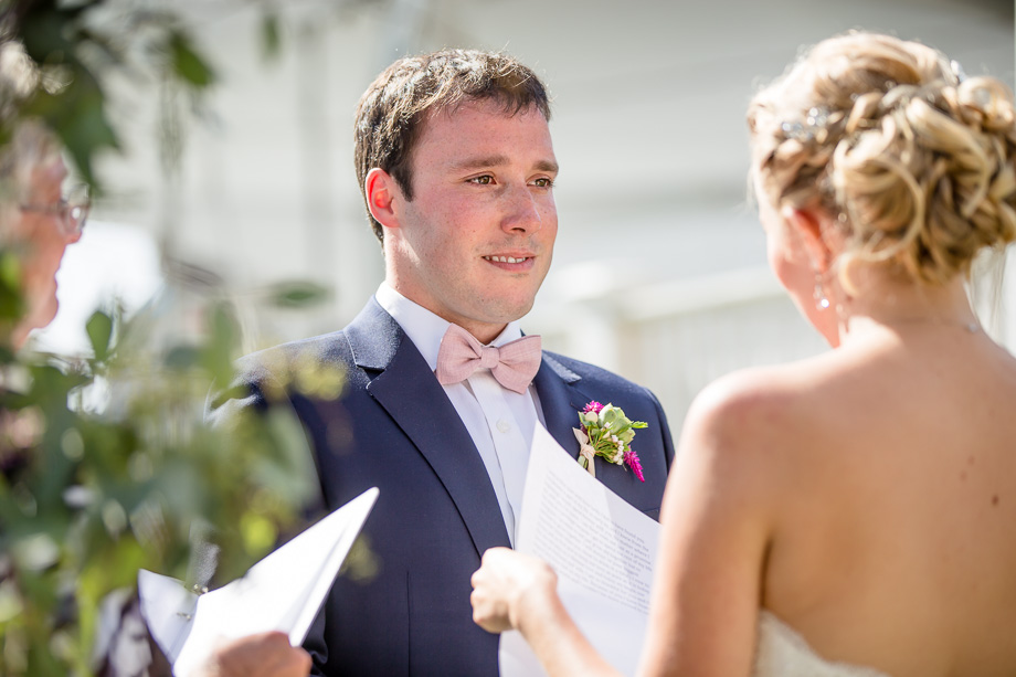 groom listening to bride's vows