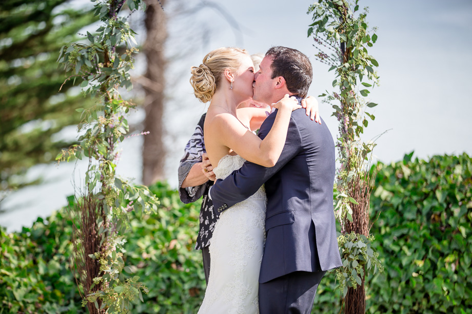 bride and groom kiss