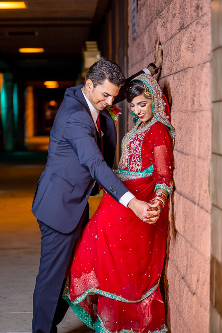 colorful wedding portrait against brick wall