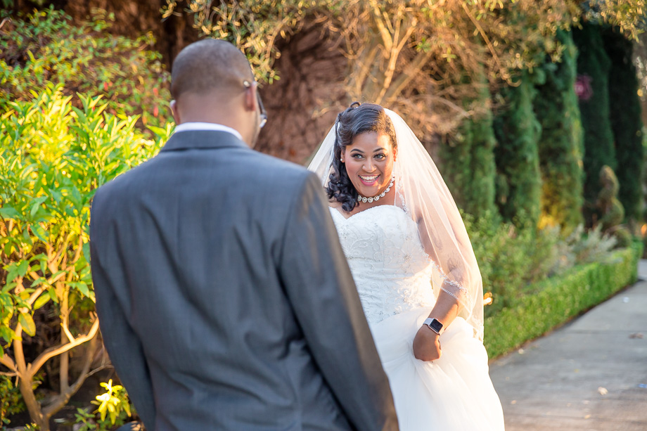 bride with cute expression in first look photo