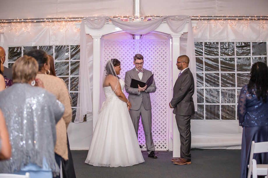 wedding ceremony in white tent