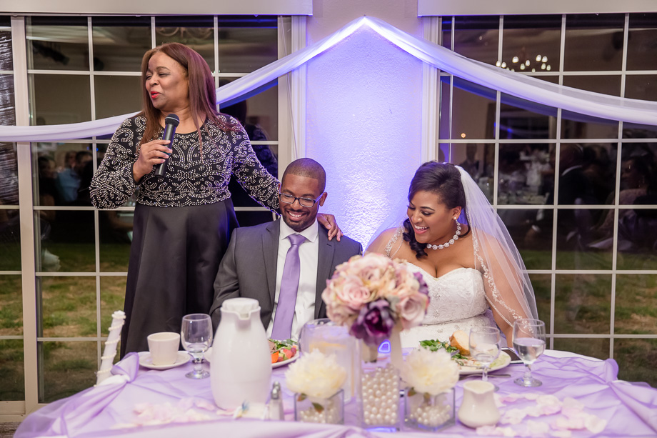 bride and groom very happy about mother's toast