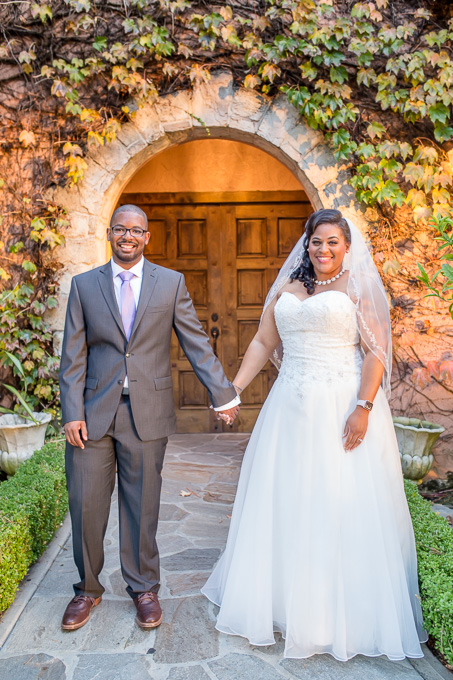 bride and groom portraits at door leading to Grandview Pavilion