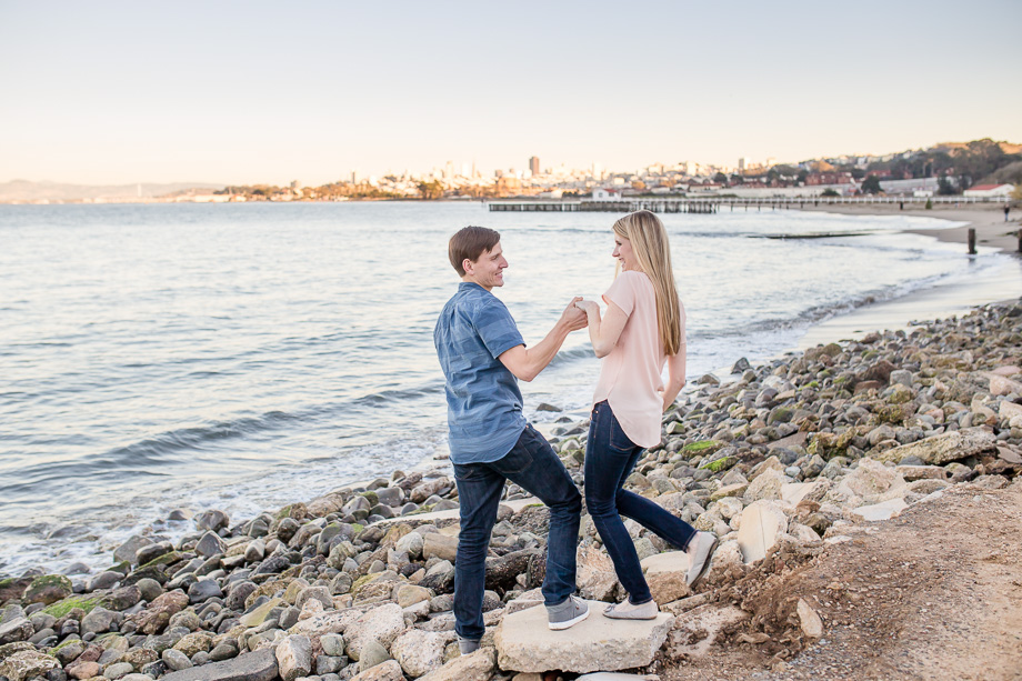 lifestyle engagement photo in front of san francisco city skyline