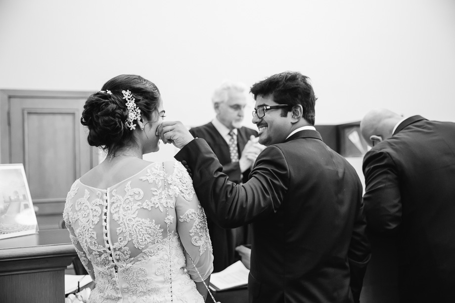 a sweet candid moment when lining up for marriage license at San Francisco City Hall