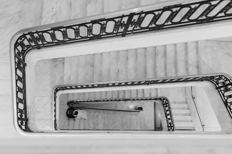 creative wedding photo on San Francisco City Hall spiral staircase