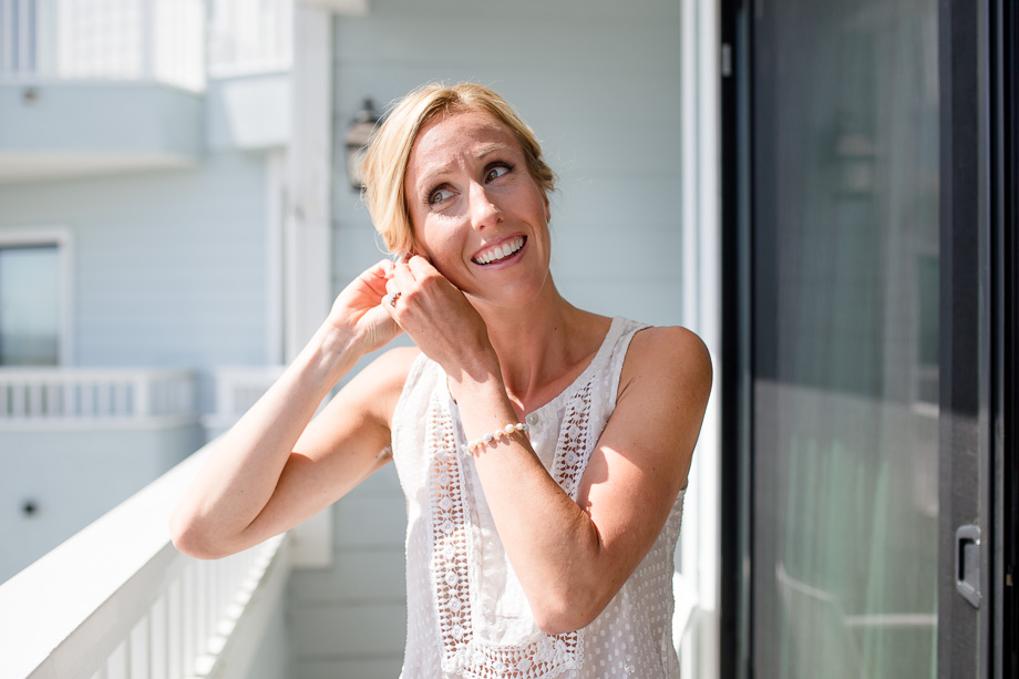 bride getting her earrings on
