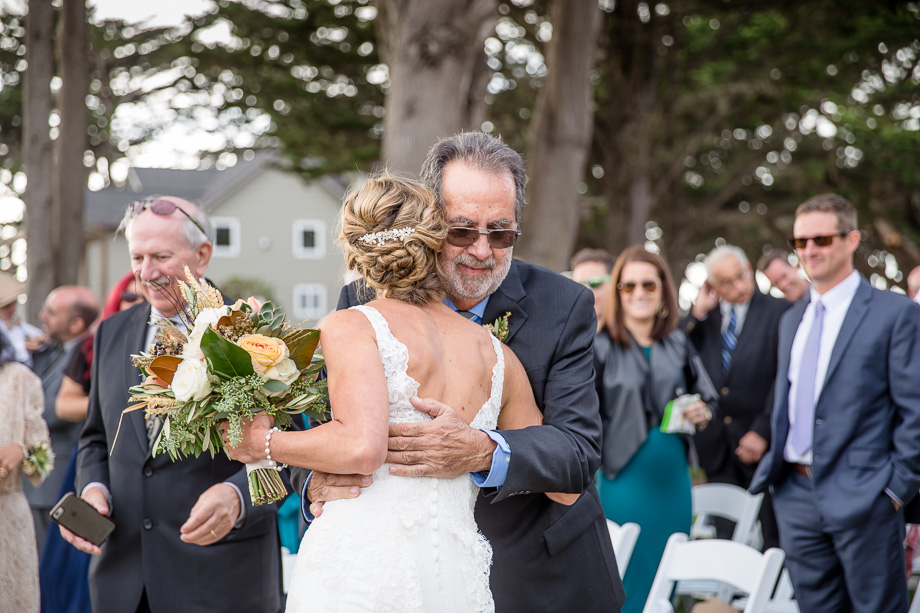bride and father hugging before the ceremony
