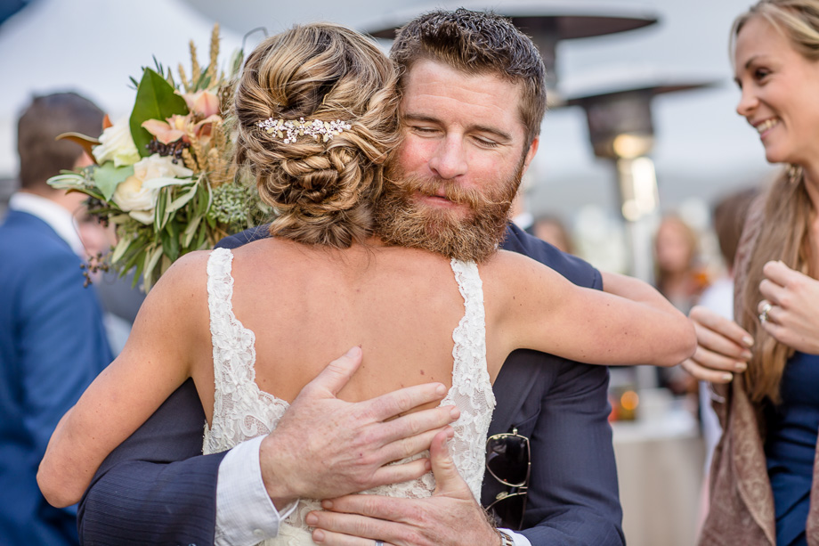 emotional hug with bride after ceremony