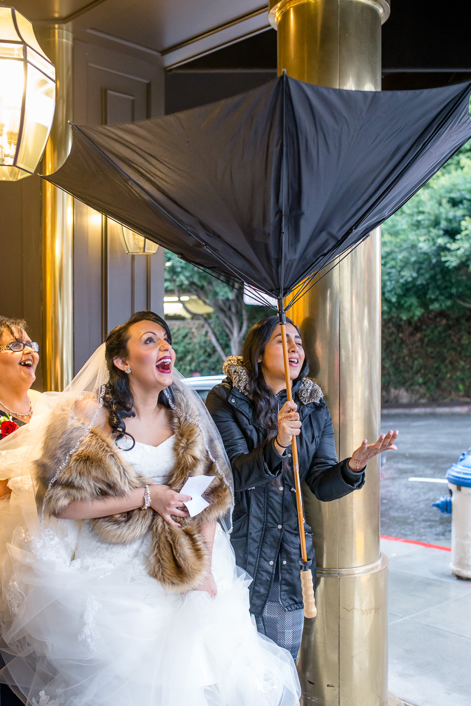 The umbrella flipped upside down when the bride stepped out the hotel lobby for her SF City hall wedding