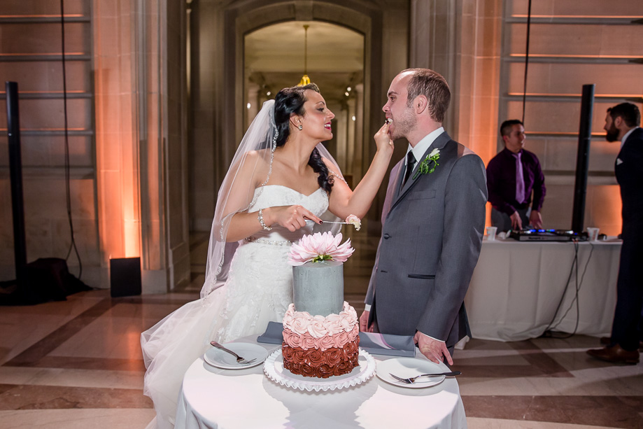 feeding each other wedding cake