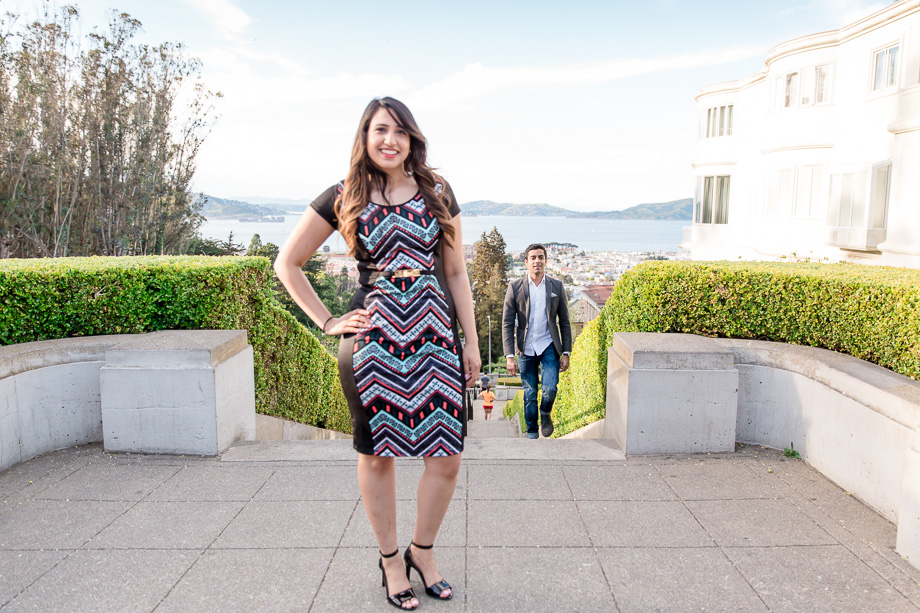 portrait of boyfriend sneaking up for a surprise proposal