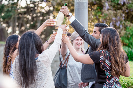 celebrating engagement with champagne