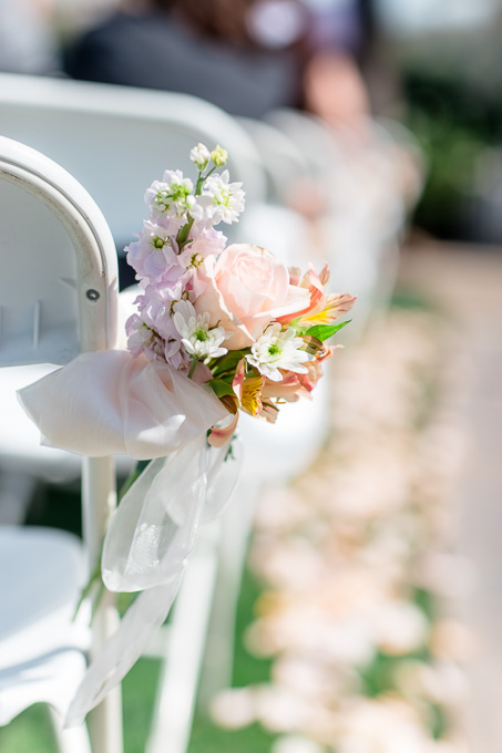 cute flower decoration on chair during wedding ceremony