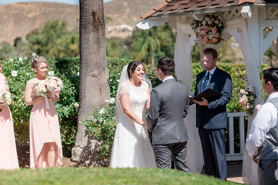 brides priceless reaction when officiant announces the couple are married