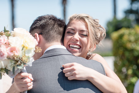 groom's sister hugging him