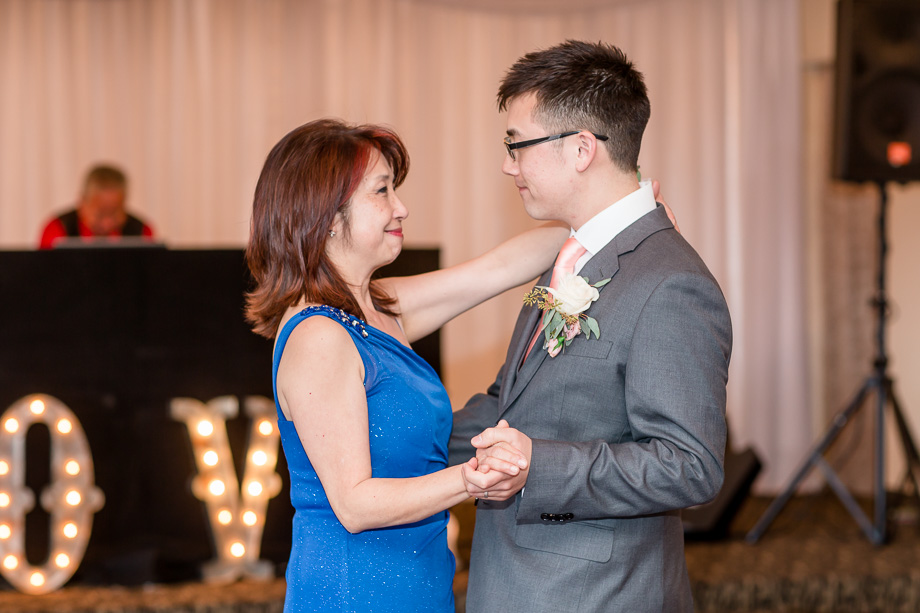 groom dancing with mother