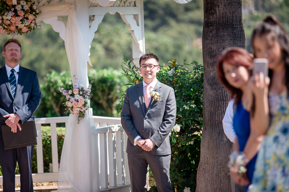 groom anxiously waiting for his bride at wedding ceremony