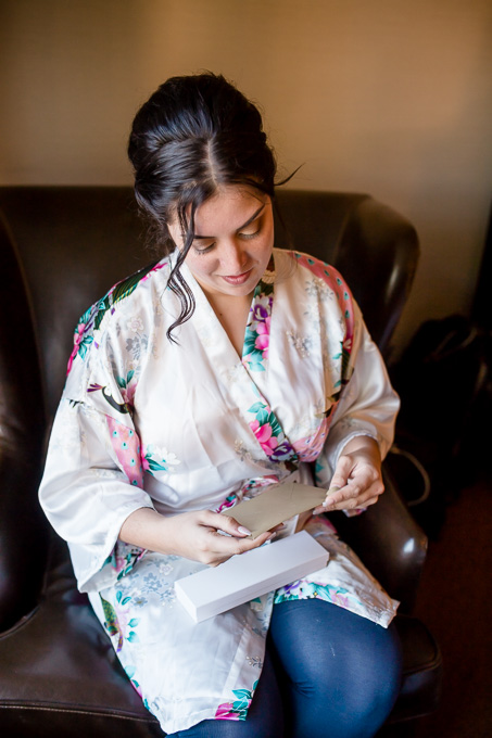 bride enjoying her groom's wedding present