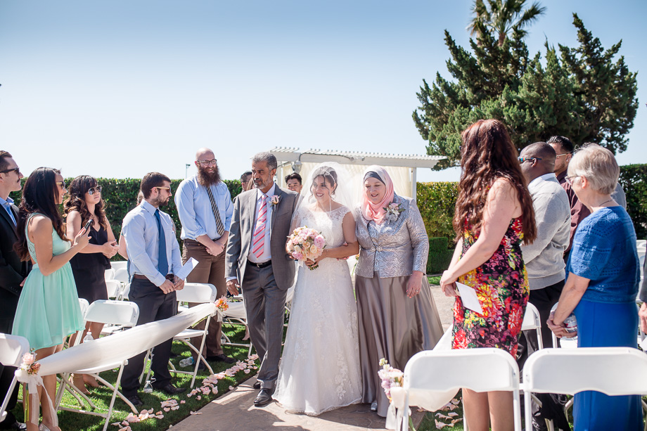 bride walking down the aisle at Indian Hills Golf Course