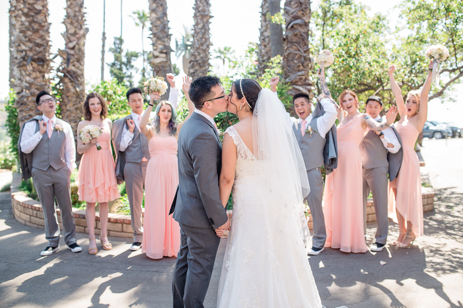 a cute bridal party picture with 4 bridesmaids and 4 groomsmen