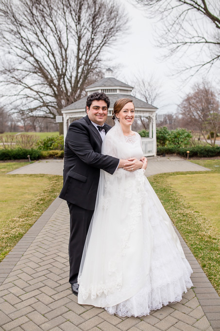bride and groom portraits in front of gazebo