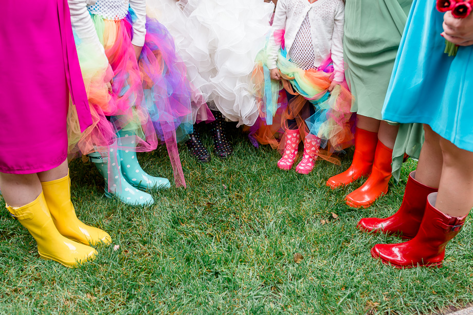 colorful bridesmaid dresses and rain boots for rainbow themed wedding