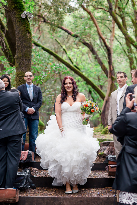 bride walking down the aisle at park wedding