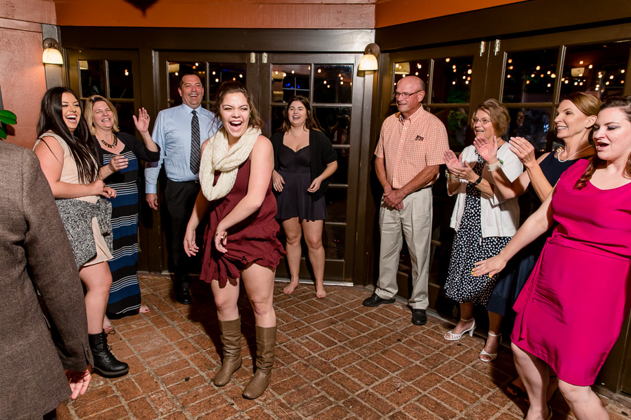 wedding guests cheering and laughing