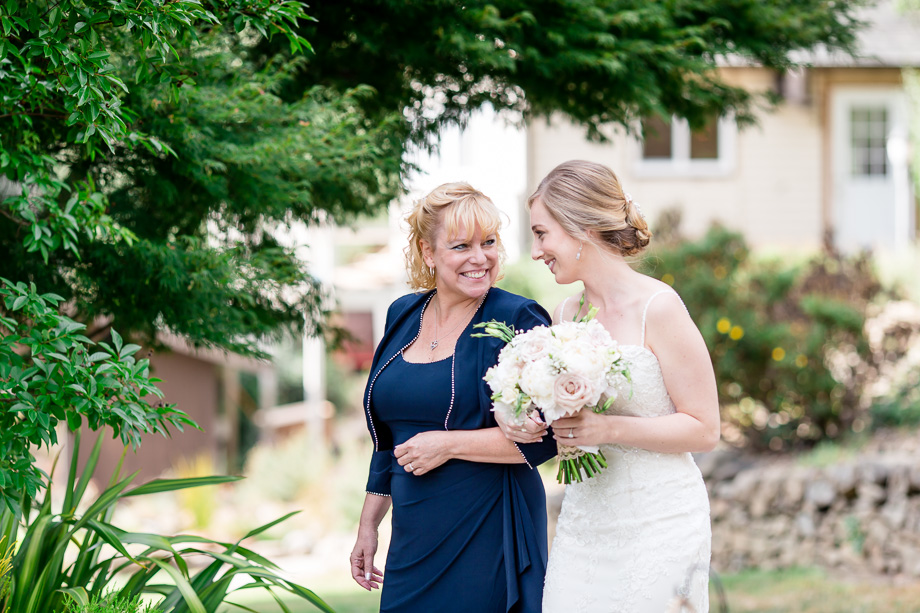 bride and mother walking down the aisle