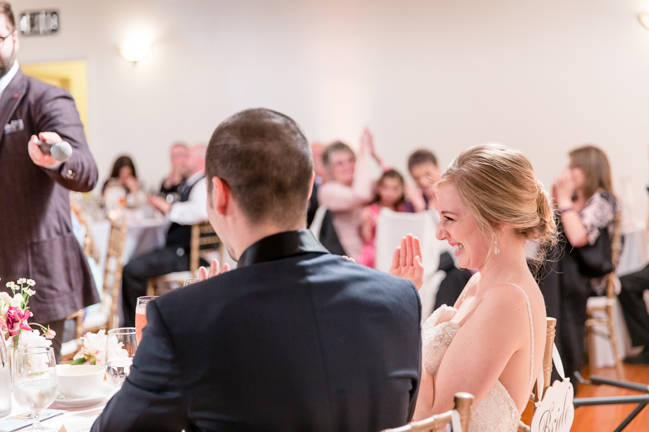 bride and groom enjoying themselves during toasts