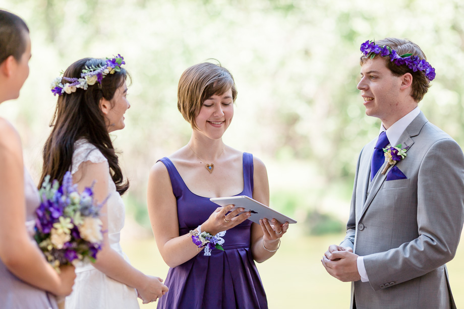 couple exchanging vows in front of family and friends at Yosemite