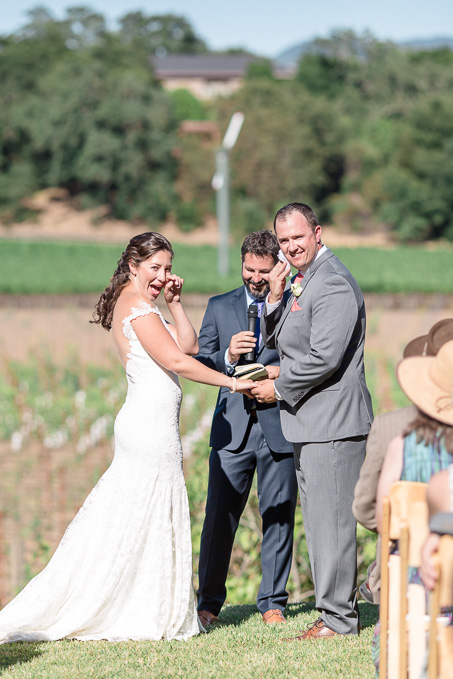 bride and groom crying and laughing at the same time