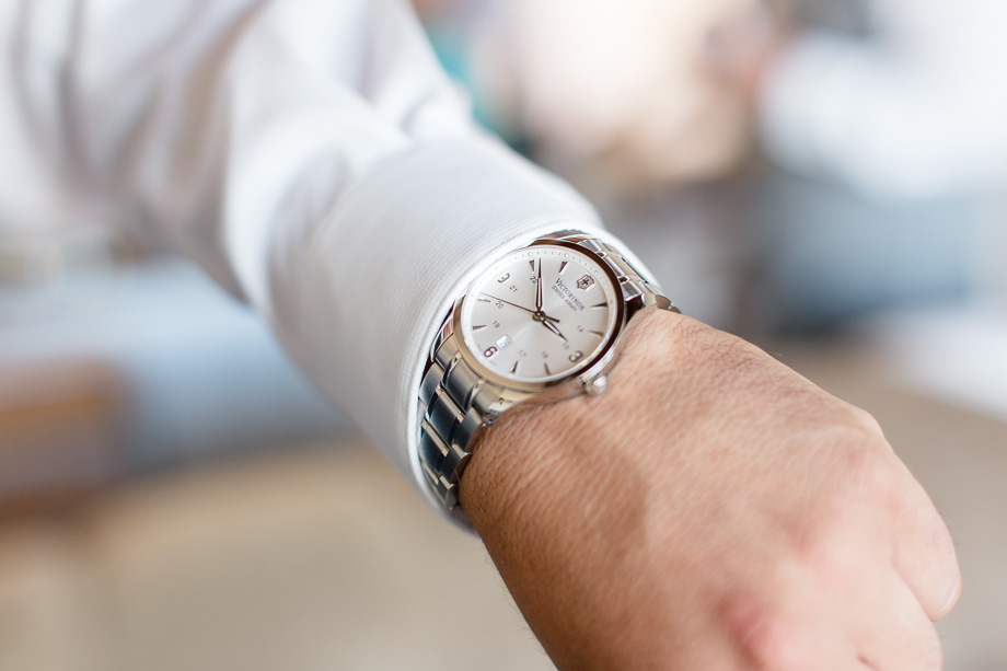 a sweet surprise the bride gifted the groom on their wedding day - a classic watch that has their wedding date engraved on the inside