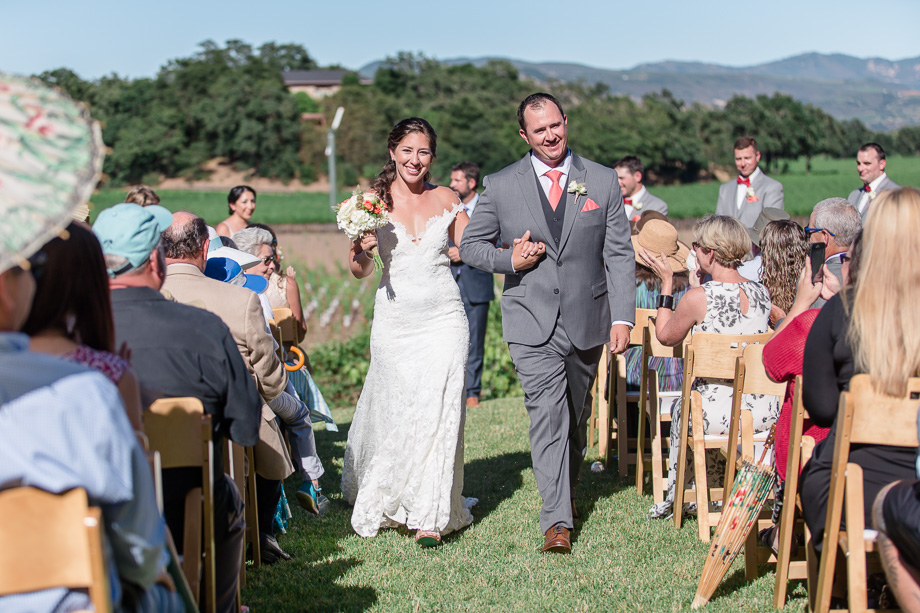 couple walking down the aisle the recessional