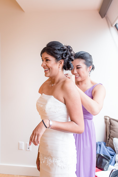 putting on the final bling for the bride