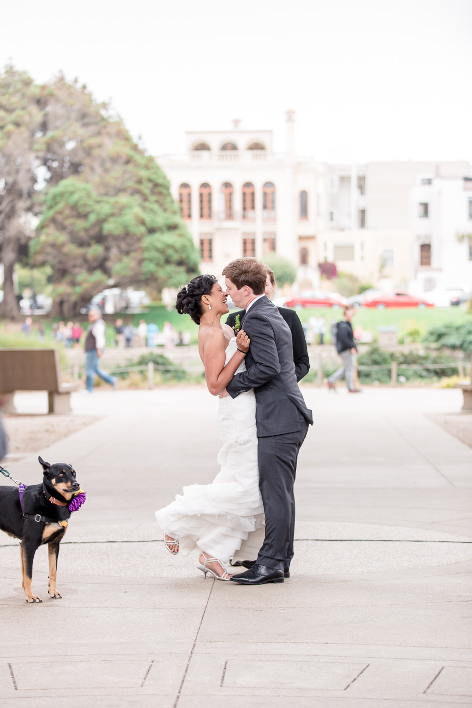 a romantic first kiss as husband and wife at the Palace of Fine Arts in SF