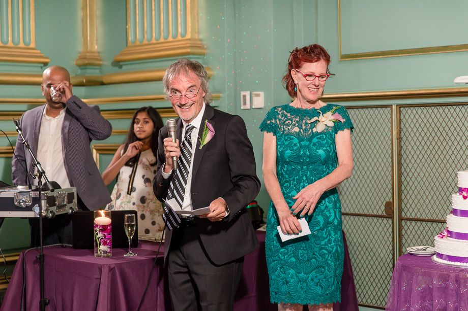 grooms parents giving a heartwarming speech