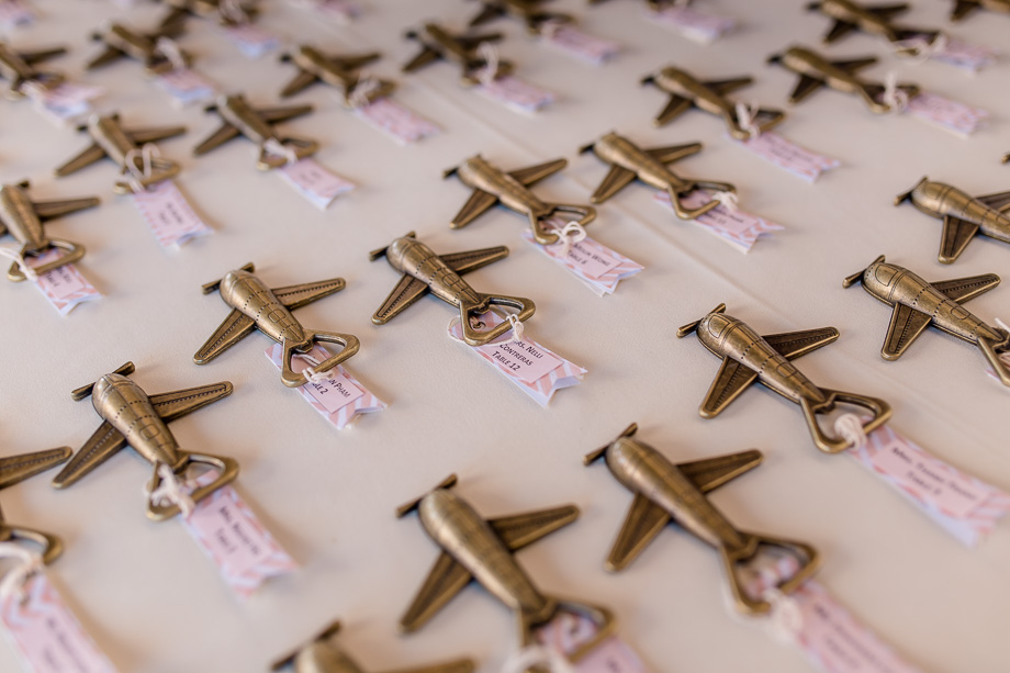 travel themed wedding guest escort cards - airplane bottle opener