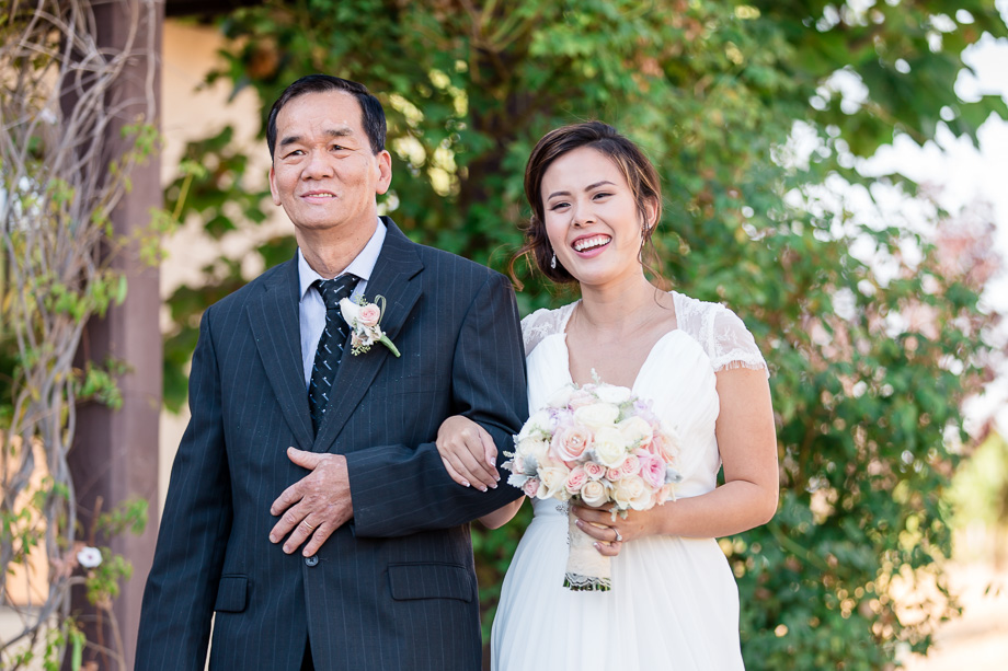happy bride walking down the aisle