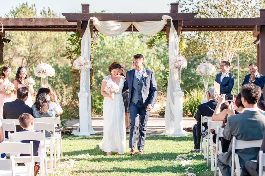 walking down the aisle together as husband and wife