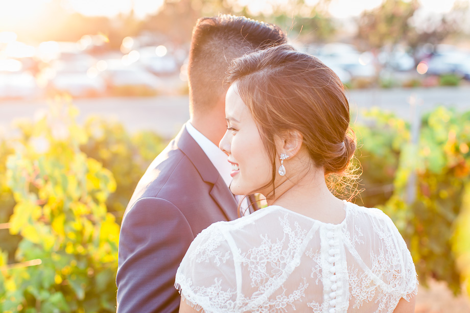 sunflare photo of the bride and groom at a winery