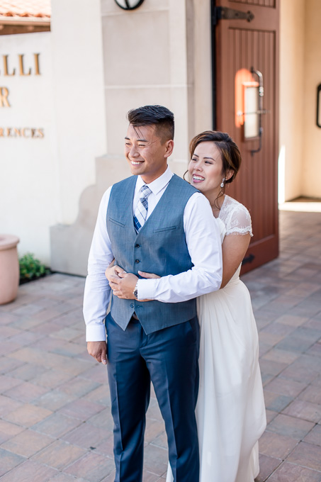 the moment before the groom turns around to see his bride for the first time on their wedding day